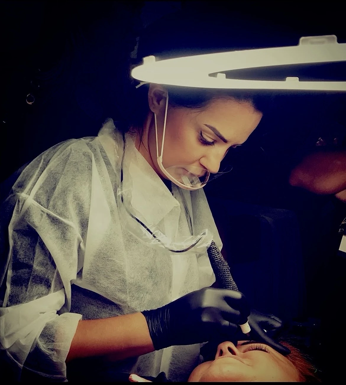 Ksenija Karabegovic performing eyebrow restoration work for Smile Is Enough